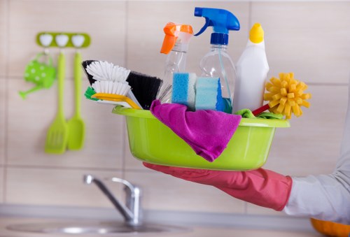 Cleaning staff following safe workplace procedures in a professional environment