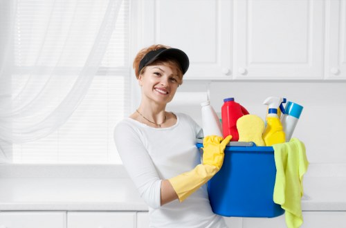 Earlscourt Cleaners staff member preparing cleaning equipment with safety awareness