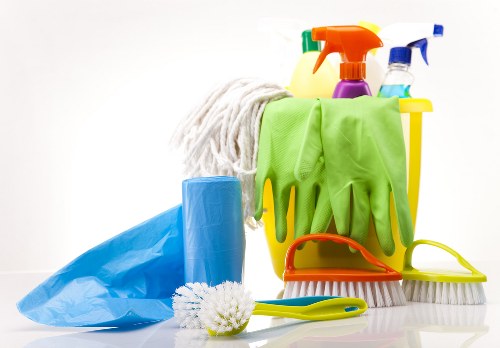 Technician using steam cleaning equipment for carpet cleaning in Earlscourt