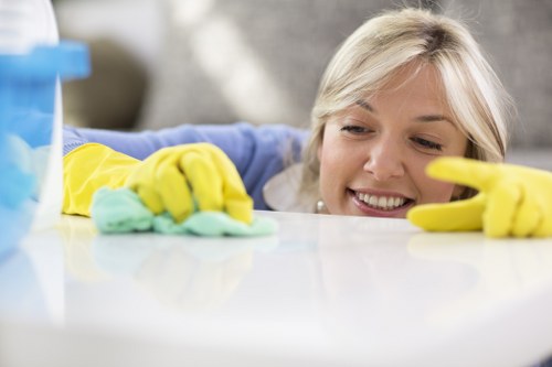 Employee using protective equipment during cleaning tasks