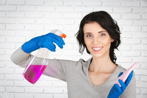 Professional office cleaning team servicing desks and common areas